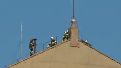 Vatican firefighters install a chimney on the roof of the Sistine Chapel for the papal election